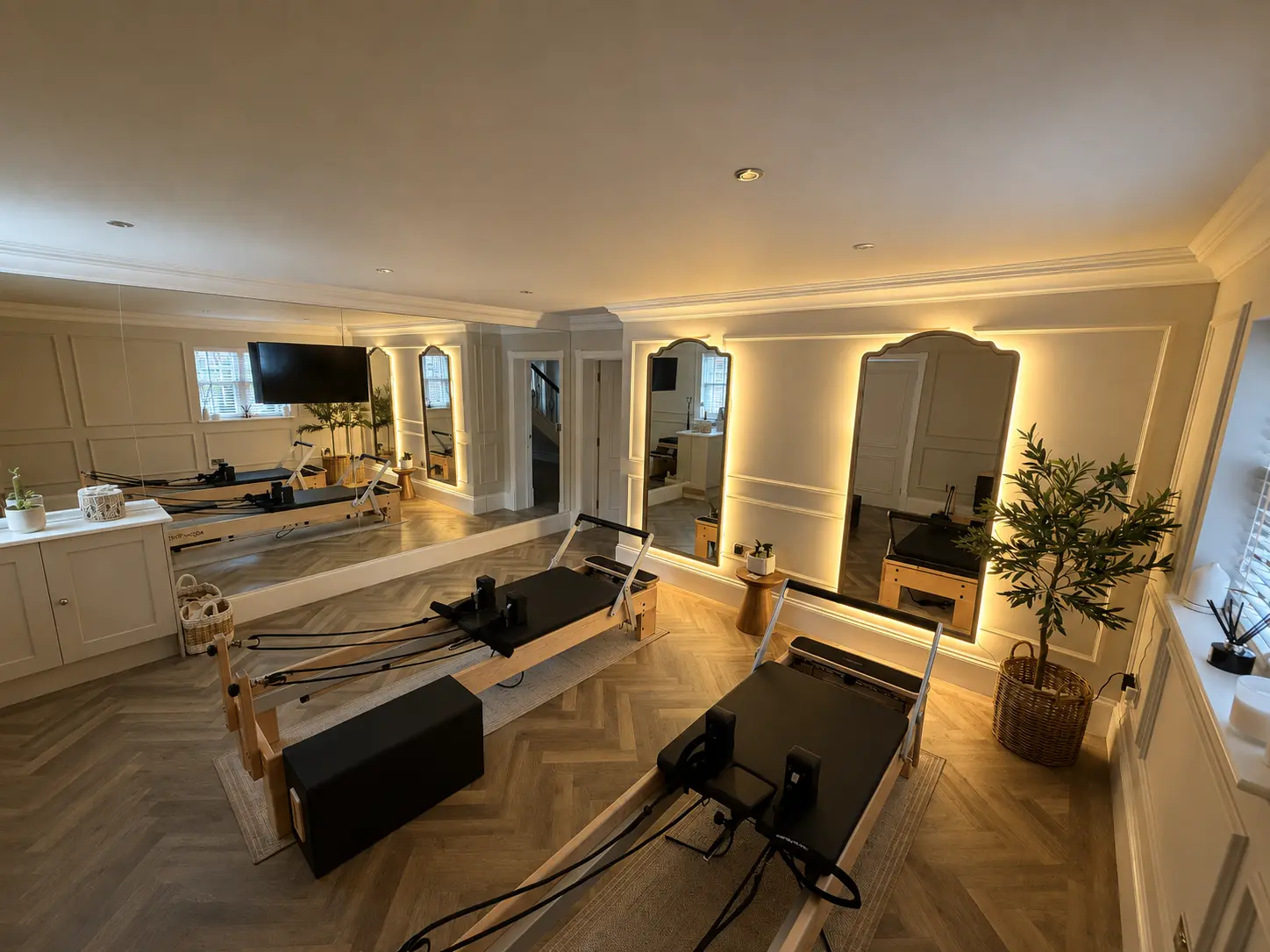Wide-angle view of the full Rewind Pilates studio and its two reformers