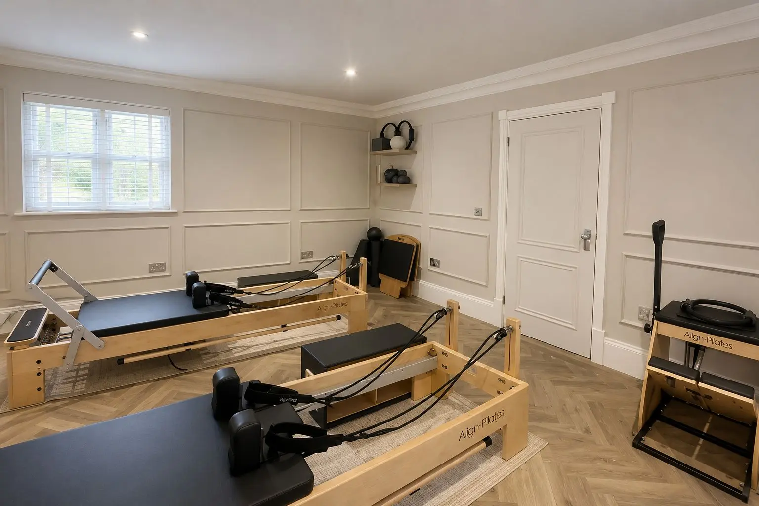 A wide view of the private Rewind Pilates studio and its reformer equipment